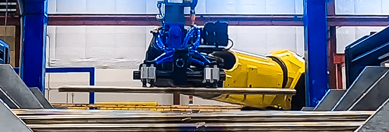 Industrial robot picking up a metallic part from a bin